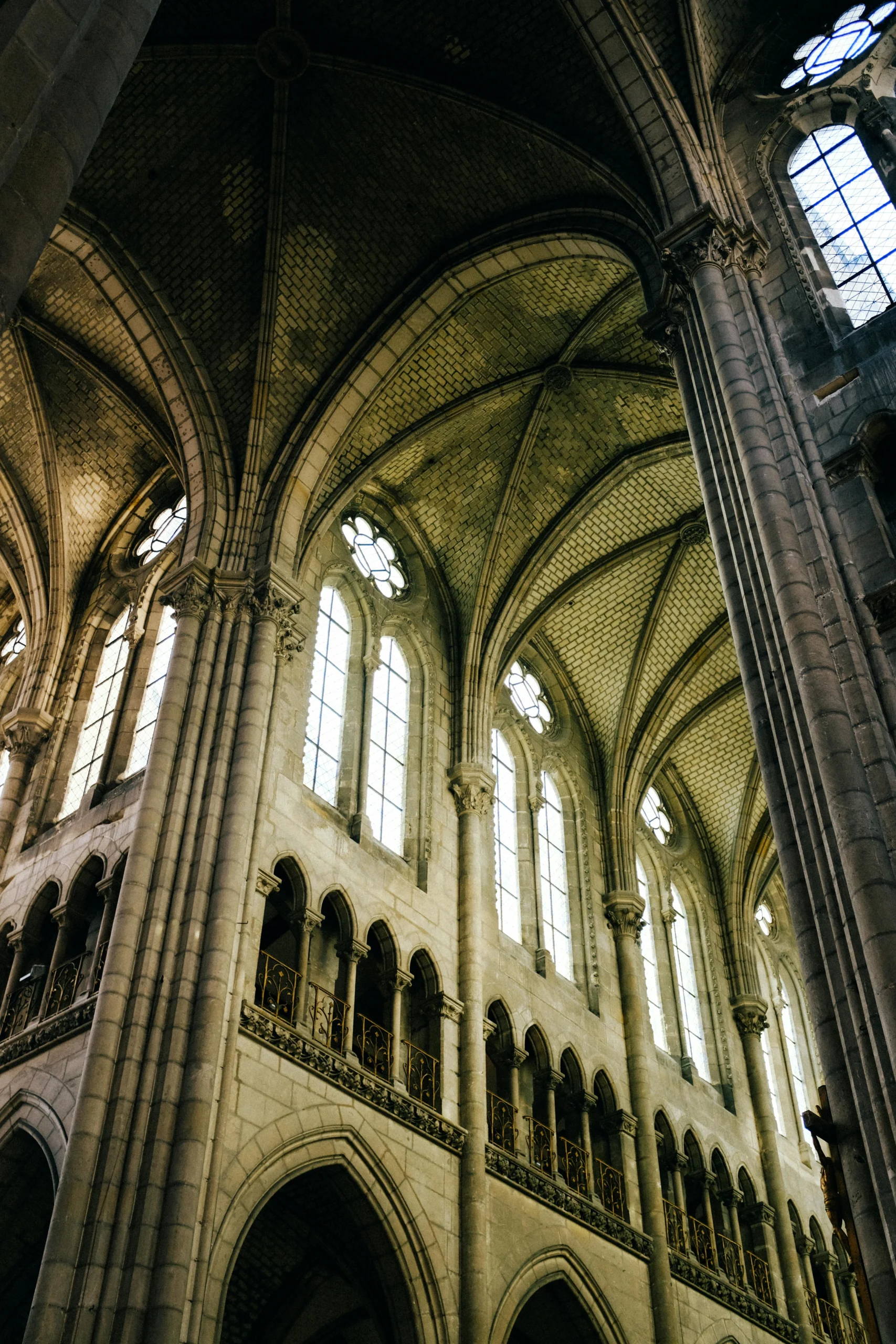 The Abbey of Saint-Denis exterior rendered in early Gothic period style.